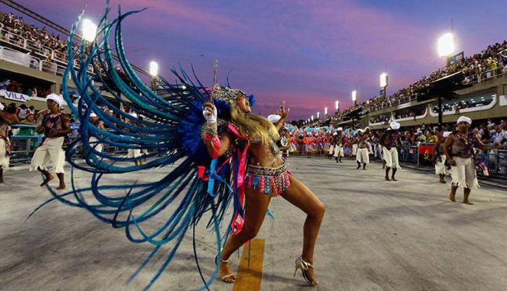 a-reveller-from-the-vila-isabel-samba-school-parades-on-the-first-night-of-the-annual-carnival-parade-in-rio-de-janeiros-sambadrome